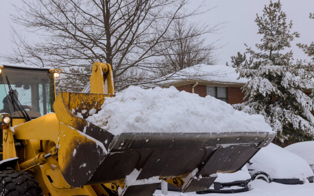 Tractor clears snow removal after snowfall blizzards clearing